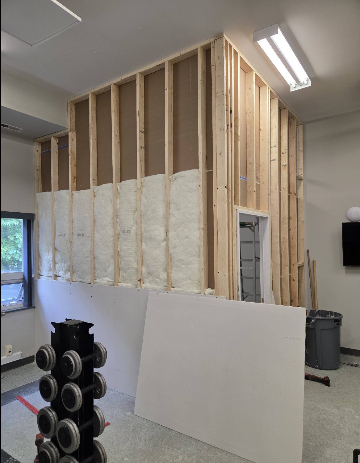 New interior wall framed and insulated by Garland Contracting