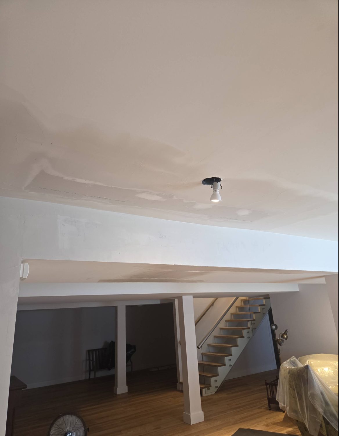 Interior renovation with a rebuilt ceiling and open stairwell